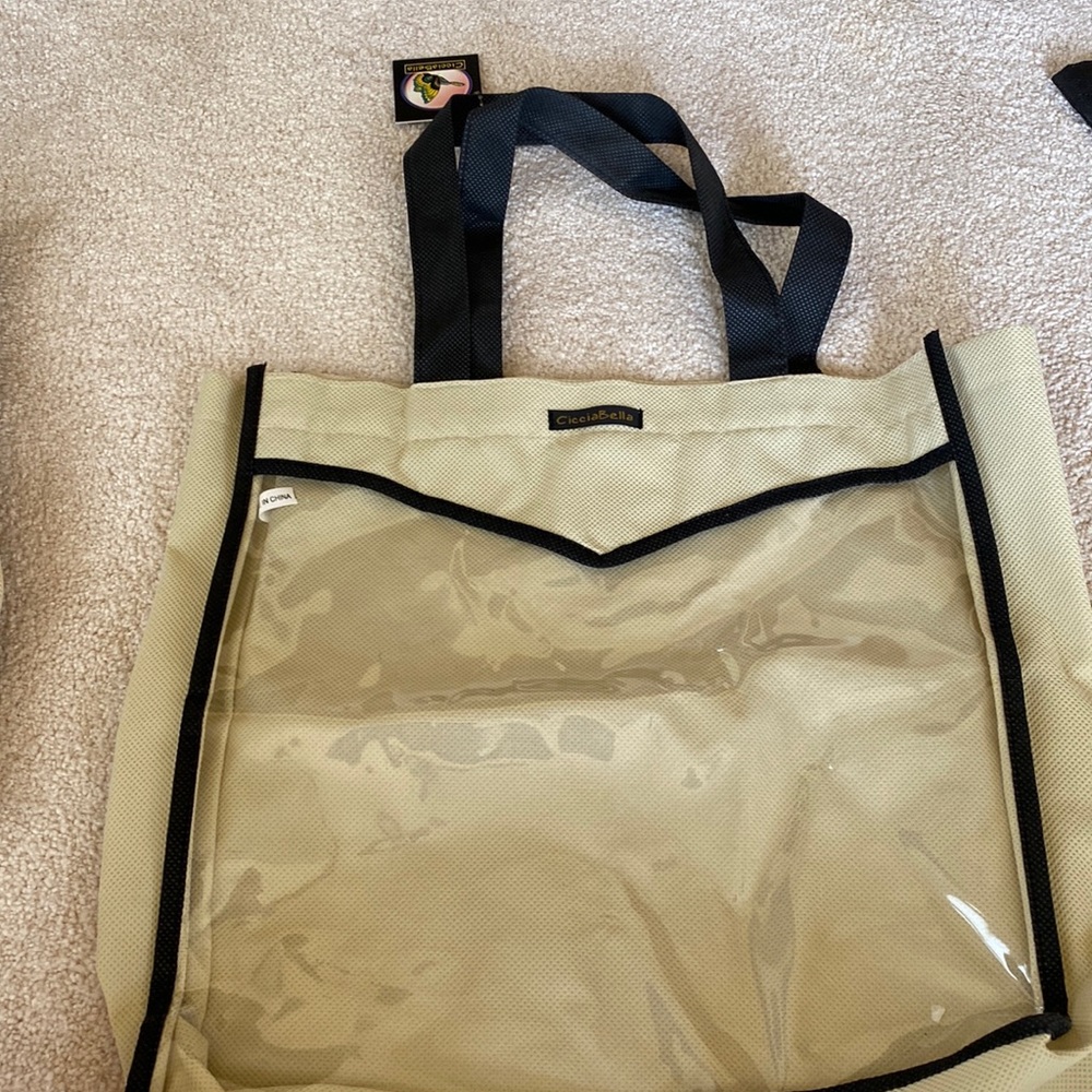 CicciaBella bags (2) with clear front, navy strap handles, Velcro closure.
